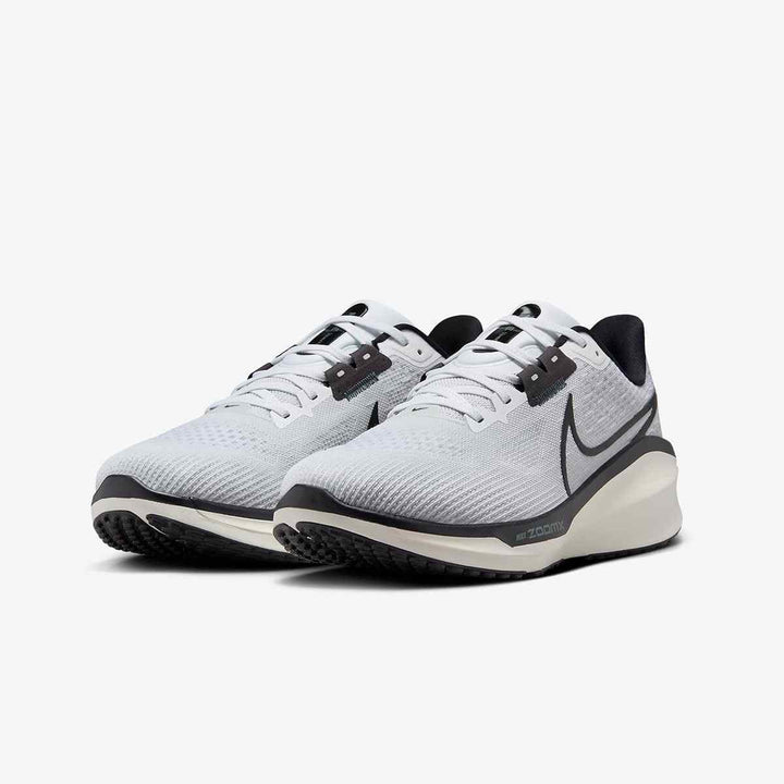 Nike ZoomX Pegasus 40 running shoes in white with black accents, featuring ZoomX technology and lightweight mesh upper for optimal comfort and performance.