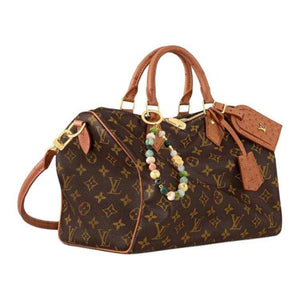 حقيبة Louis Vuitton Monogram بجلد Ostrich بني وأنيق.