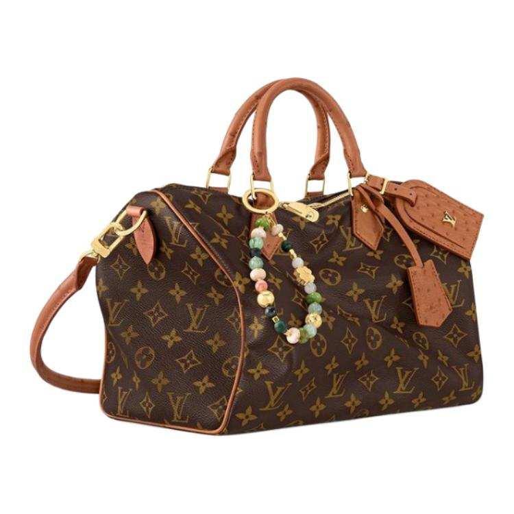 حقيبة Louis Vuitton Monogram بجلد Ostrich بني وأنيق.