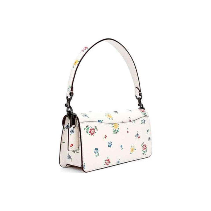  رحقيبة كتف نسائية من Coach بطبعة زهور برية مرقطة، لون طباشيري، تصميم أنيق وعصري.