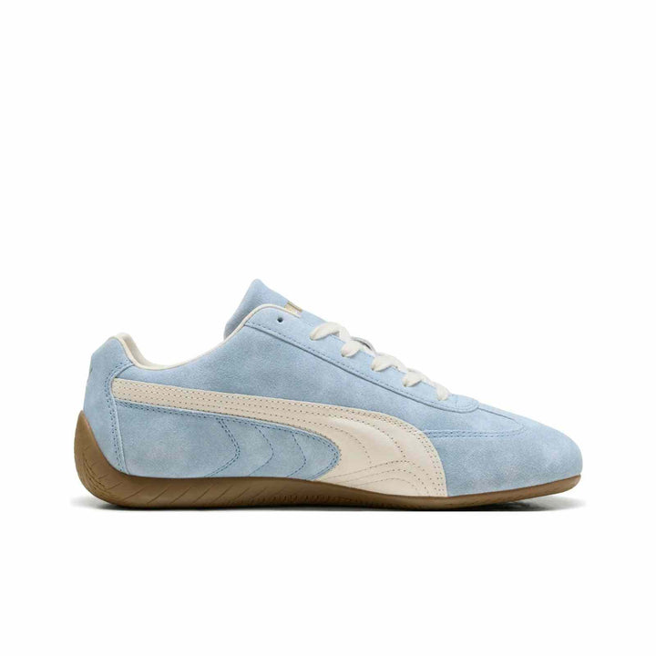 PUMA Palermo OG Vintage sneaker in light blue suede with ivory stripes and brown rubber sole.