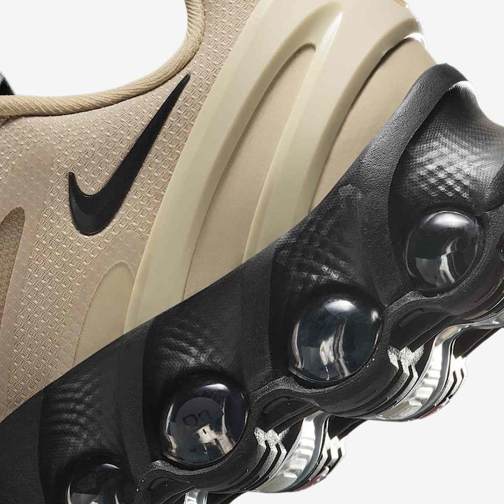 Nike AIR MAX DN8 men's sneakers with shock-absorbing outsole, featuring a low-top design and modern style.