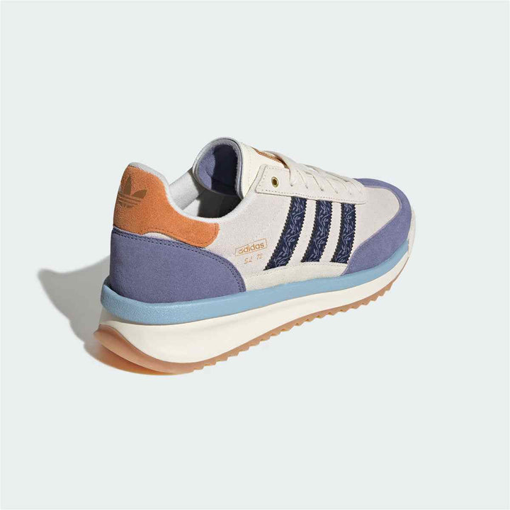 Adidas Clover casual sneaker with modern design in blue and beige, featuring durable leather and suede materials.