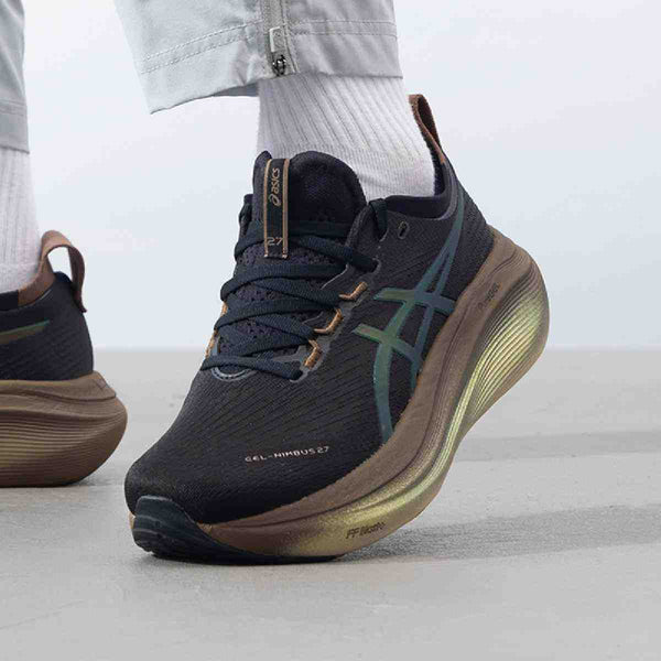 ASICS Gel-Nimbus 27 black running shoe with bronze accents and cushioned sole.