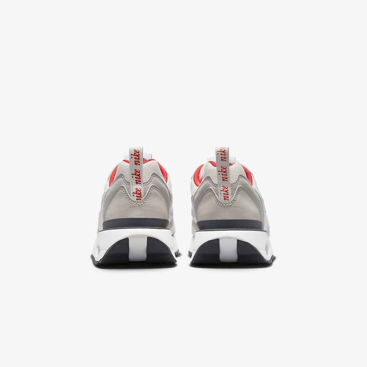 Nike Air Max Dawn shoes in gray, white with red accents, featuring visible air cushioning and durable materials.