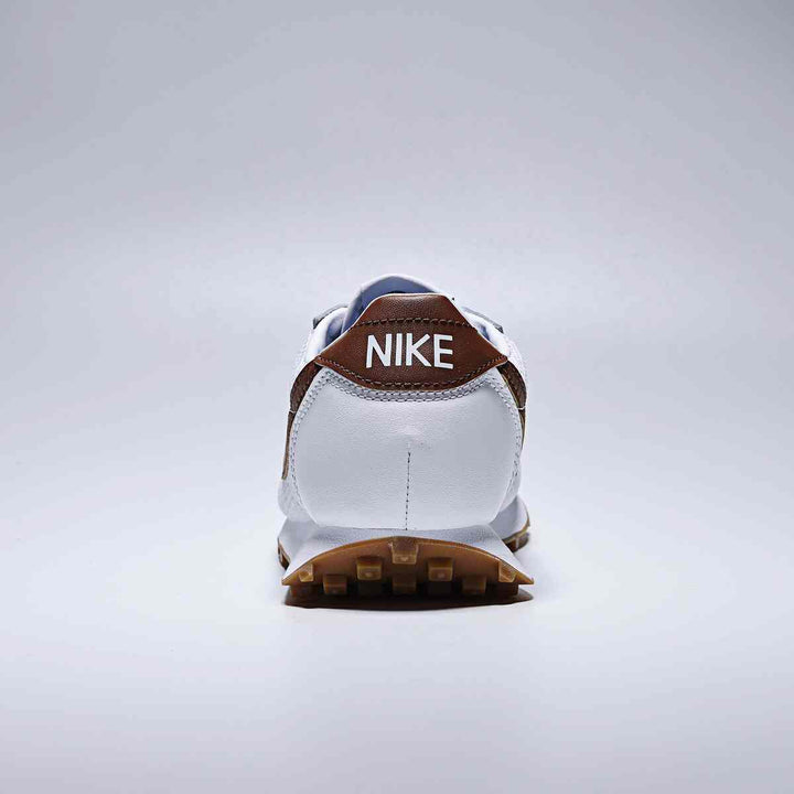 Rear view of Nike LD-1000 running shoe with wide heel design and white and brown color scheme