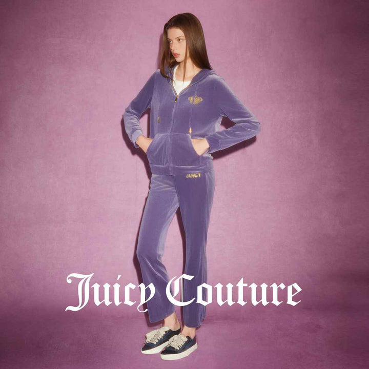 Velvet Juicy Couture pants in purple with embroidered logo.