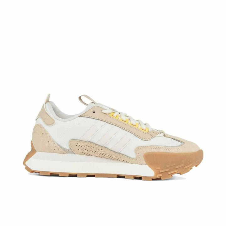 adidas classic sports shoe in beige and white with suede accents and rubber sole for added stability.