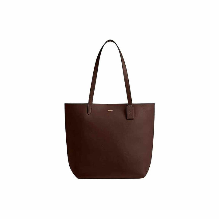 حقيبة يد مانهاتن من Coach جلد طبيعي بني شوكولا تصميم Tote أنيق وعصري سعة كبيرة مع شعار ذهبي ومقابض طويلة