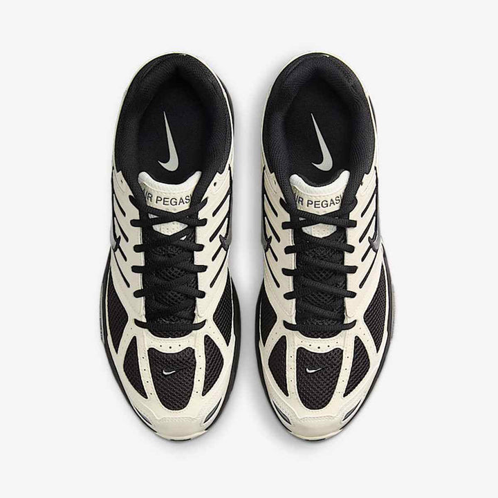 Nike Air Pegasus 2006 sneakers, classic black and cream design, featuring mesh and synthetic materials for comfort and style.