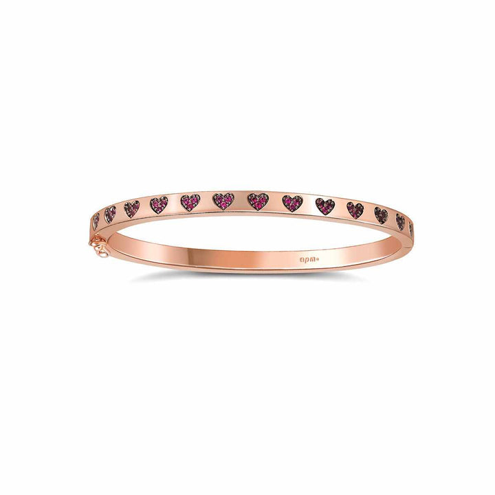 Elegant APM MONACO rose gold bracelet with sparkling pink crystal hearts.
