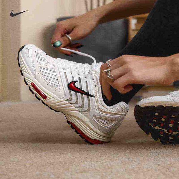 Nike Air Pegasus 2006 white running shoe with red and black logo and full-length Nike Air cushioning