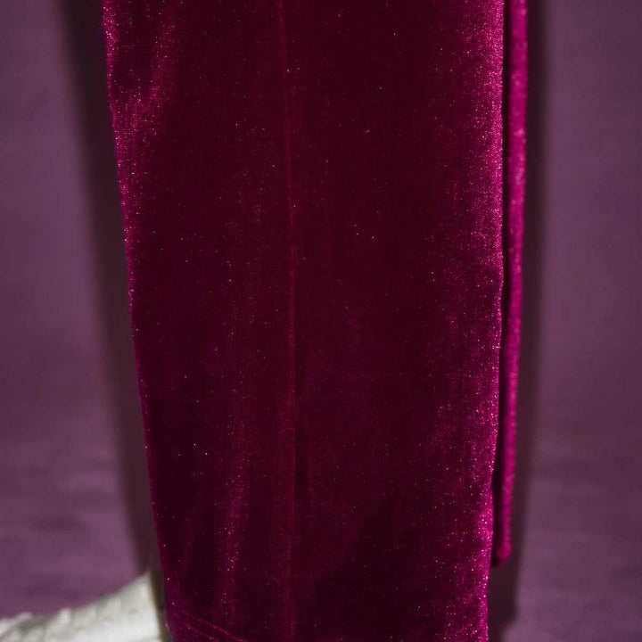 Juicy Couture velvet pants with luxurious, shiny texture and classic wide-leg design.