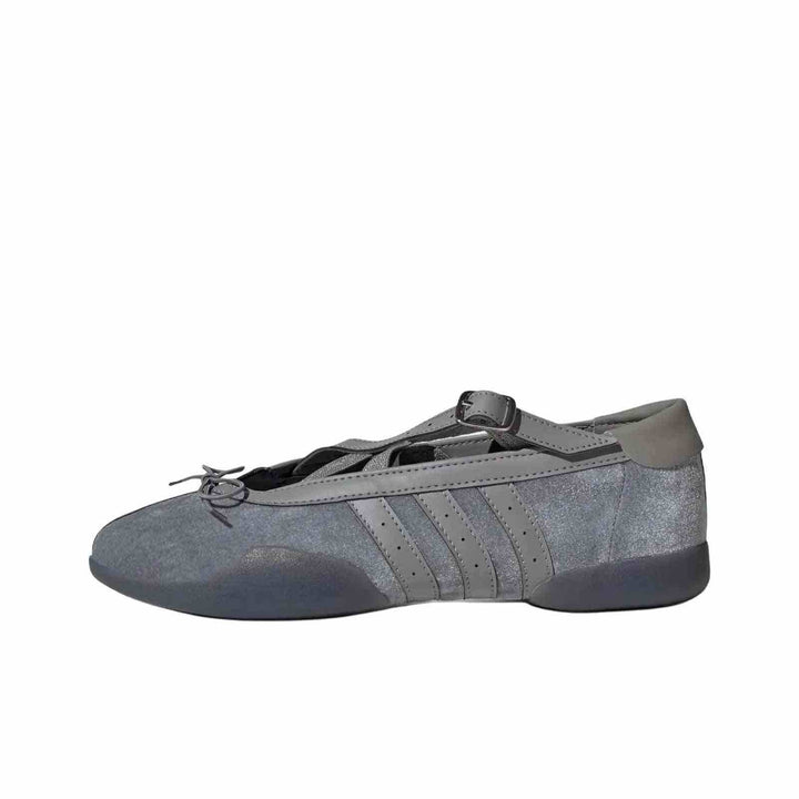 Grey Adidas Ballet Flats with shiny finish, leather details, crossed buckle straps, and flexible sole.