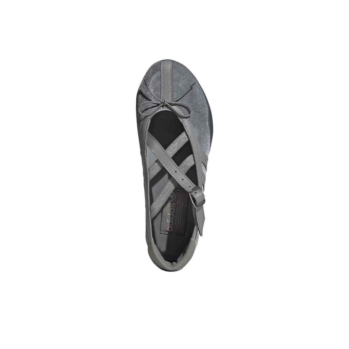 Grey Adidas Ballet Flats with shiny upper, leather details, cross straps, and flexible sole.
