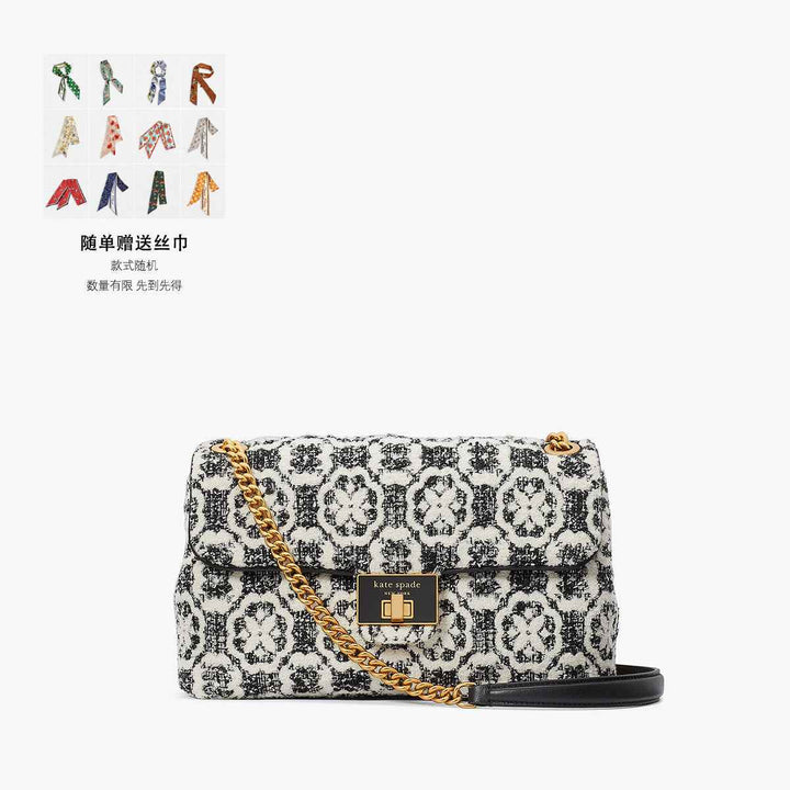 Kate Spade Evelyn luxury fabric bag with black and white woven design and gold chain.