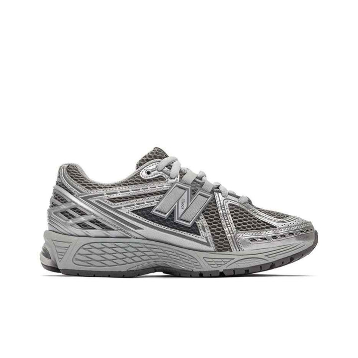 New Balance 1906R metallic silver running shoe with breathable mesh and cushioned sole for all-day comfort