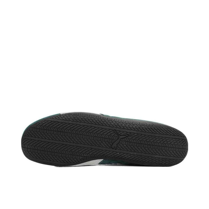 Puma Speedcat OG sneaker bottom view showcasing sleek black rubber sole.
