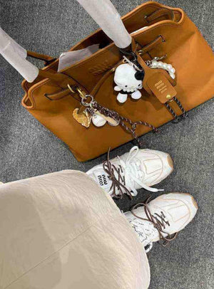 سنيكرز 530 أسفل الكاحل جلد نيو بالانس × ميو ميو New Balance X Miu Miu.