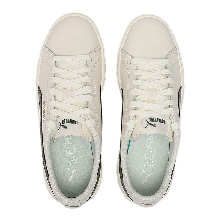 Puma ivory sneakers with olive side stripe, sleek design, Puma logo, casual style.