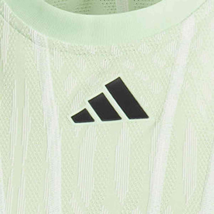 Close-up of the adidas Women's Sport Dress featuring the iconic logo and textured fabric.