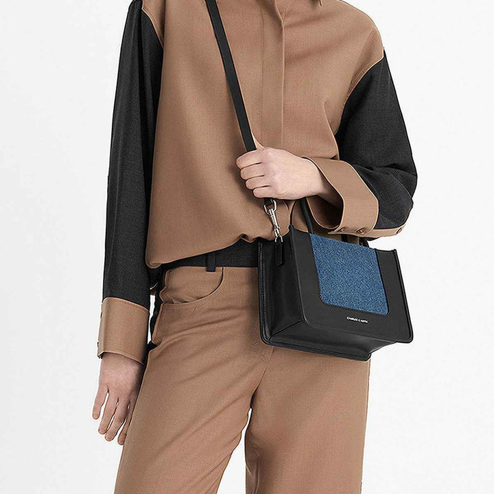 CHARLES&KEITH black handbag with denim touch and detachable strap.