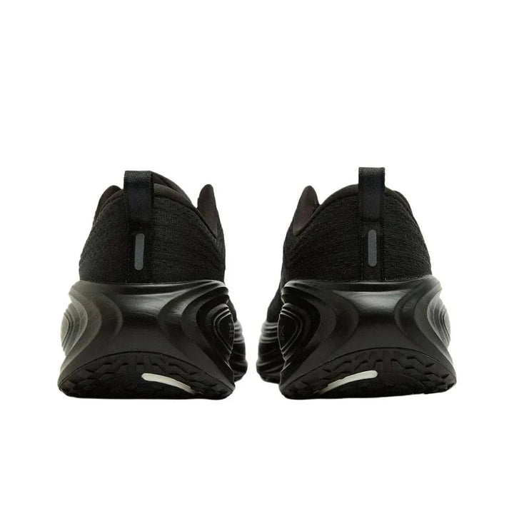 Nike Vomero Plus black running shoes rear view with reflective details and durable outsole