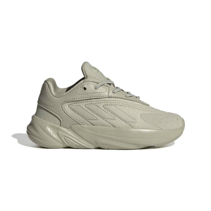 Adidas children's Ozelia sneakers in trendy gray, featuring a futuristic design with premium leather and mesh upper, Boost cushioning, and durable rubber sole for comfort and flexibility.