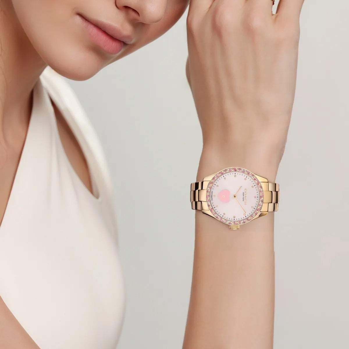 COACH women's pink watch.