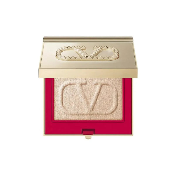 فالنتينو Valentino Beauty illuminating powder in elegant gold compact with embossed logo and red interior.