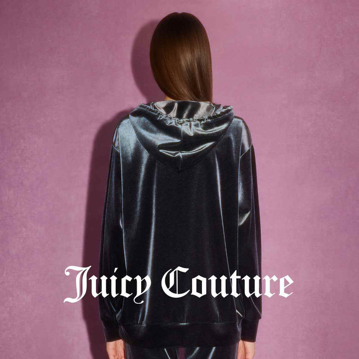 Juicy Couture black velvet hoodie with red sequined graphic, luxurious and modern design.