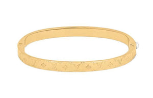 LOUIS VUITTON Logo engraved metal bracelet women's gold.