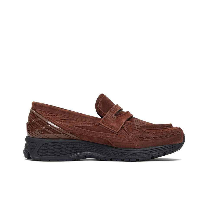 New Balance 1906 brown slip-on sneaker with mesh and leather design, comfortable rubber sole, and lace-up closure.
