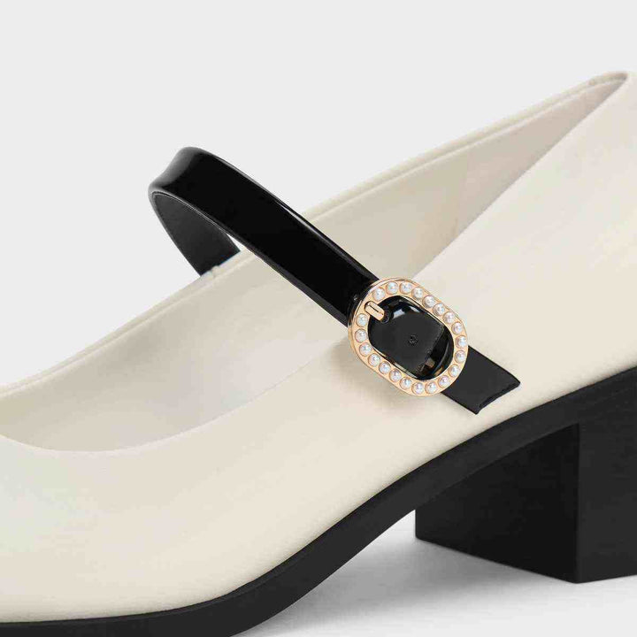 CHARLES&KEITH white and black Mary Jane shoes with wide heel and gemstone buckle.