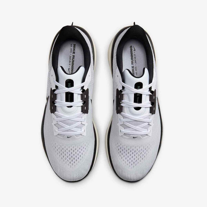 Nike ZoomX Pegasus 40 running shoes in white with black accents, featuring lightweight mesh upper and ZoomX technology.