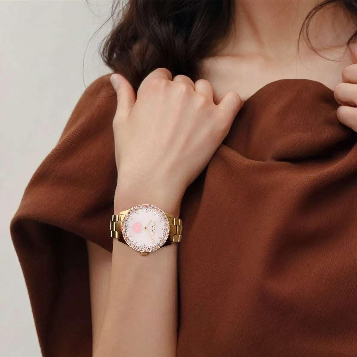 COACH women's pink watch.