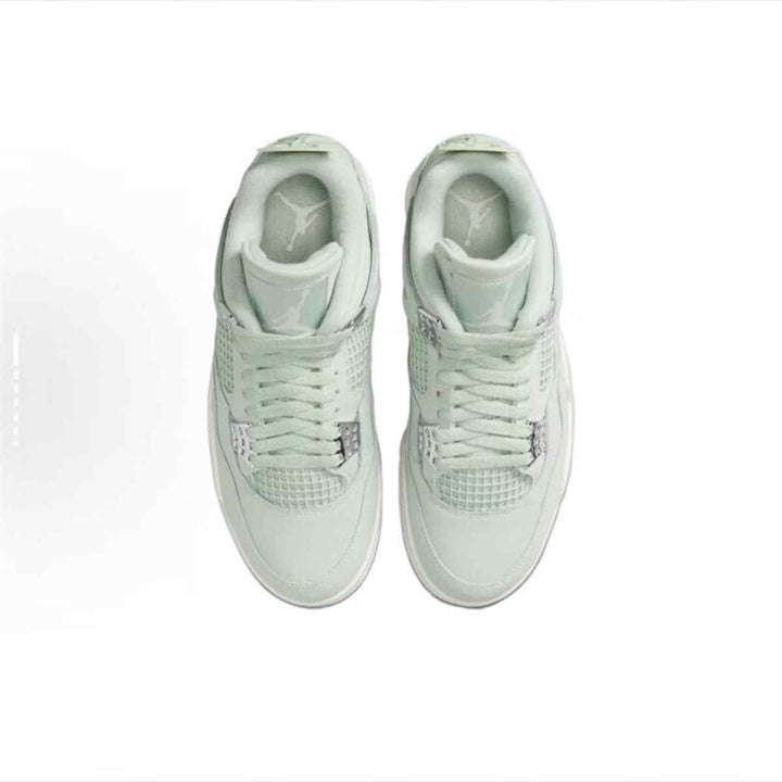 Air Jordan 4 Retro sneakers in light green Seafoam color, top view.