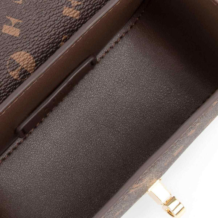 Interior view of ELLE crossbody bag, showcasing luxurious faux leather and ample storage space.