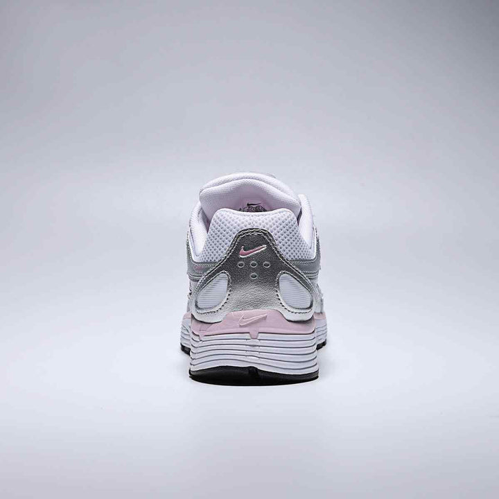 Back view of Nike | نايكي P-6000 in white, metallic silver, elemental pink, and black colors with low heel design.