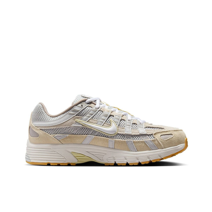 Nike P-6000 beige sneaker with yellow rubber sole and mesh design for optimal ventilation.