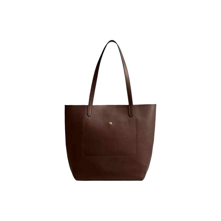 brown leather Manhattan tote handbag by Coach with front pocket and gold logo button