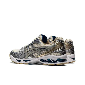 Asics Gel Kayano 14  حذاء ذهبي فضي.