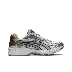 Asics Gel Kayano 14  حذاء ذهبي فضي.