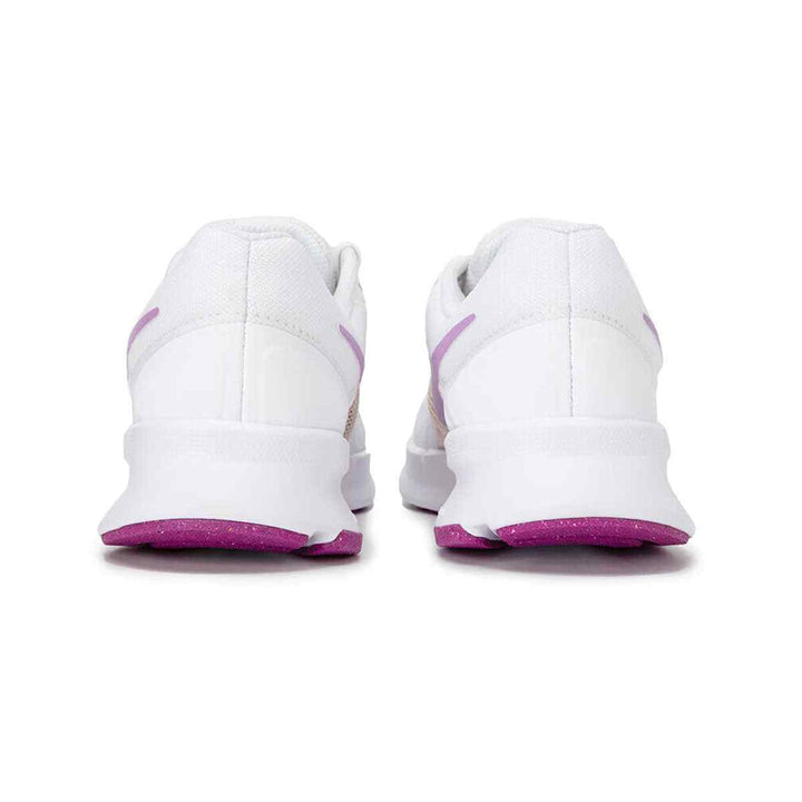 White and purple Nike Run Swift shoes with a breathable mesh design for comfort and durability.