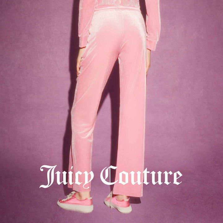 Juicy Couture pink velour pants with embroidered logo, wide-leg fit, and elastic waist.