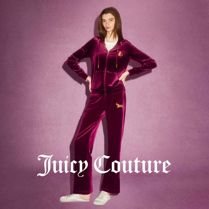 Juicy Couture velvet pants with elegant embroidery and adjustable waistband.