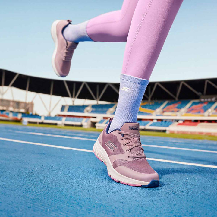 Skechers women's running shoe in synthetic material on a track.