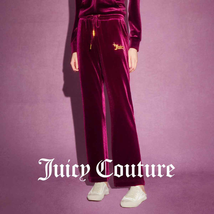 Velvet Juicy Couture pants with gold buttoned pockets, embroidered logo, and adjustable waistband.