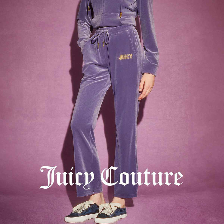 Juicy Couture purple velvet pants with wide-leg design and sparkly "JUICY" embroidery.