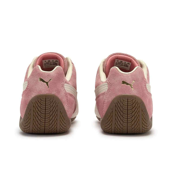 Pair of PUMA Palermo OG pink suede sneakers with whisper white accents and brown rubber soles viewed from the back